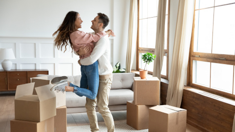 Happy couple in their new home