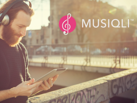 Musiqli brand imagery featuring a man using an iPad